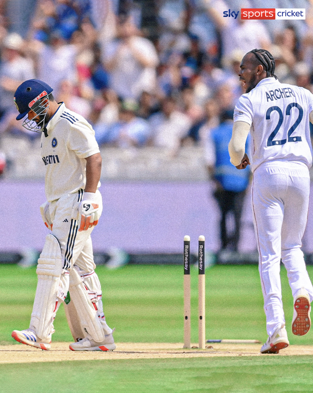 This photo shows Jofra Archer running past Rishabh Pant. Pant bows his head whilst one stump is out of the ground.